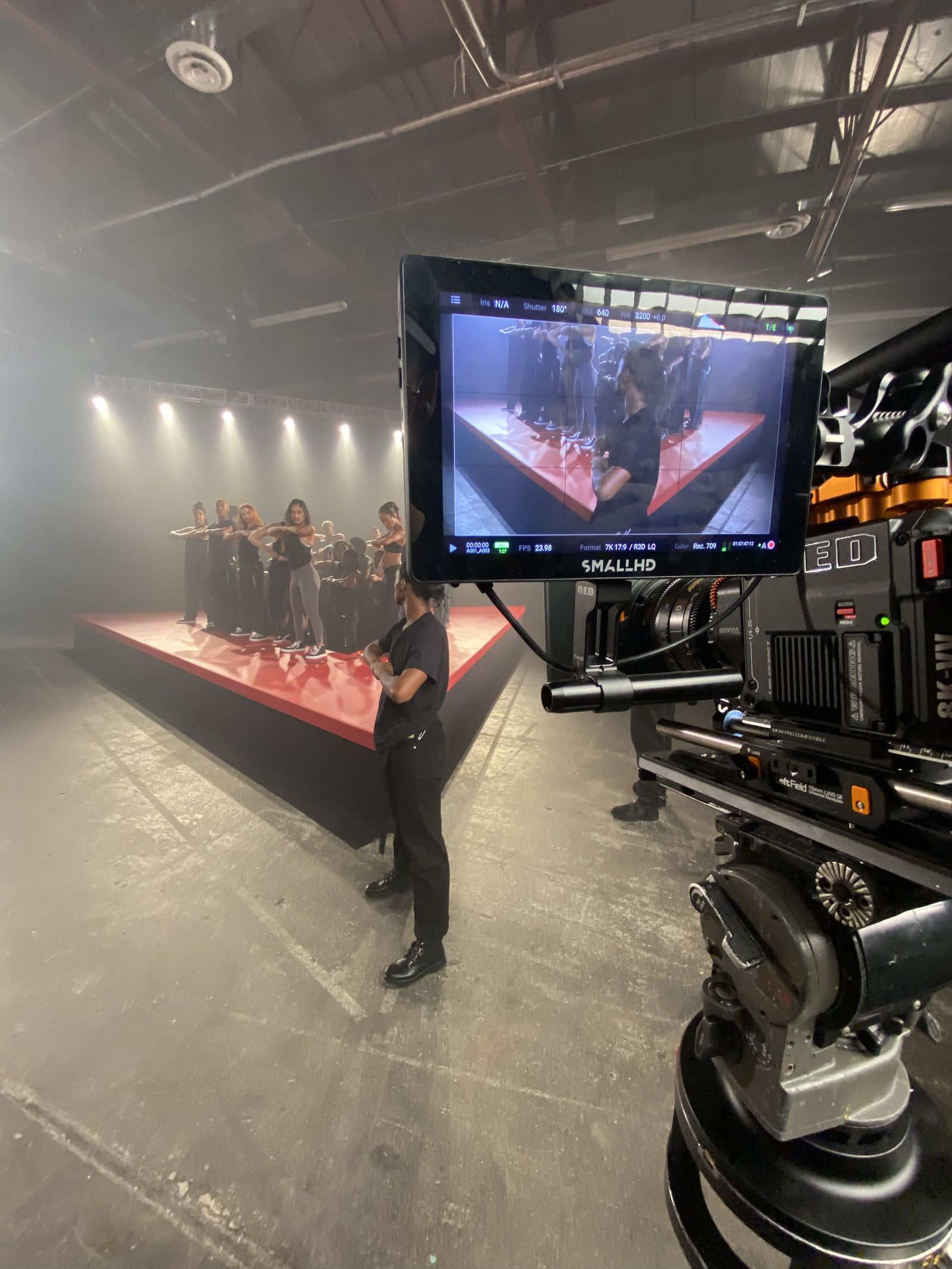 SmallHD monitor with RED frame, dancers on runway