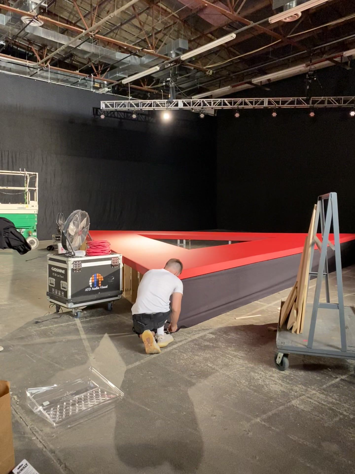 camera on dolly, red runway (video frame)