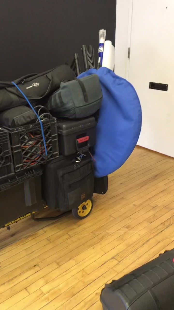 loaded gear cart, cases and grip gear (video frame)